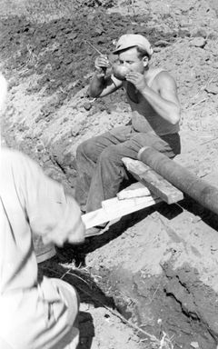 Israel, The laying of the first water pipeline, Kibbutz HaOgen, on the day of its establishment. In the photo, Guta is drinking from the ladle.

With cooperation of Nadav Mann / Bitmuna, 1947, Dany Benshalom, Rafi Benshalom, [object Object], [object Object], [object Object], Dokuforte #3433