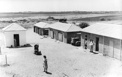 Israel, Early days at Kibbutz HaOgen: the first three barracks and the weapons room (HaNokta). Also in the picture, the first Caterpillar D4.

With cooperation of Nadav Mann / Bitmuna, 1947, Dany Benshalom, Rafi Benshalom, [object Object], [object Object], [object Object], [object Object], Dokuforte #3435