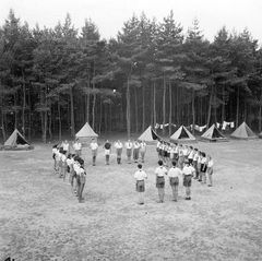 Czechoslovak Republic, Rafi - head of the summer camp/Shomrim branch at the assembly. Rafi is on the right, with his back to the camera. The entire assembly salutes with the "Shomrim Oath," including Rafi.

With cooperation of Nadav Mann / Bitmuna, 1939, Dany Benshalom, Rafi Benshalom, [object Object], [object Object], [object Object], Dokuforte #3356