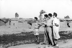 Israel, Visit an abandoned Arab village near HaOgen, Wadi Qubani. On the right: Tamar Benshalom, receiving an explanation. This was just before we departed for the mission to Prague.

With cooperation of Nadav Mann / Bitmuna, 1947, Dany Benshalom, Rafi Benshalom, [object Object], [object Object], [object Object], Dokuforte #3451